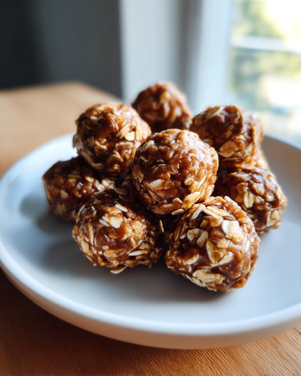 A close-up shot of a pile of no bake protein balls made with oats and a sticky binder.